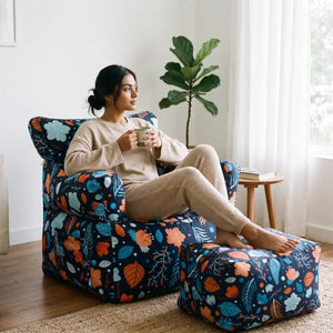 Royal Chair Elta: woman relaxing with her feet on the footstool - Magalis Egypt