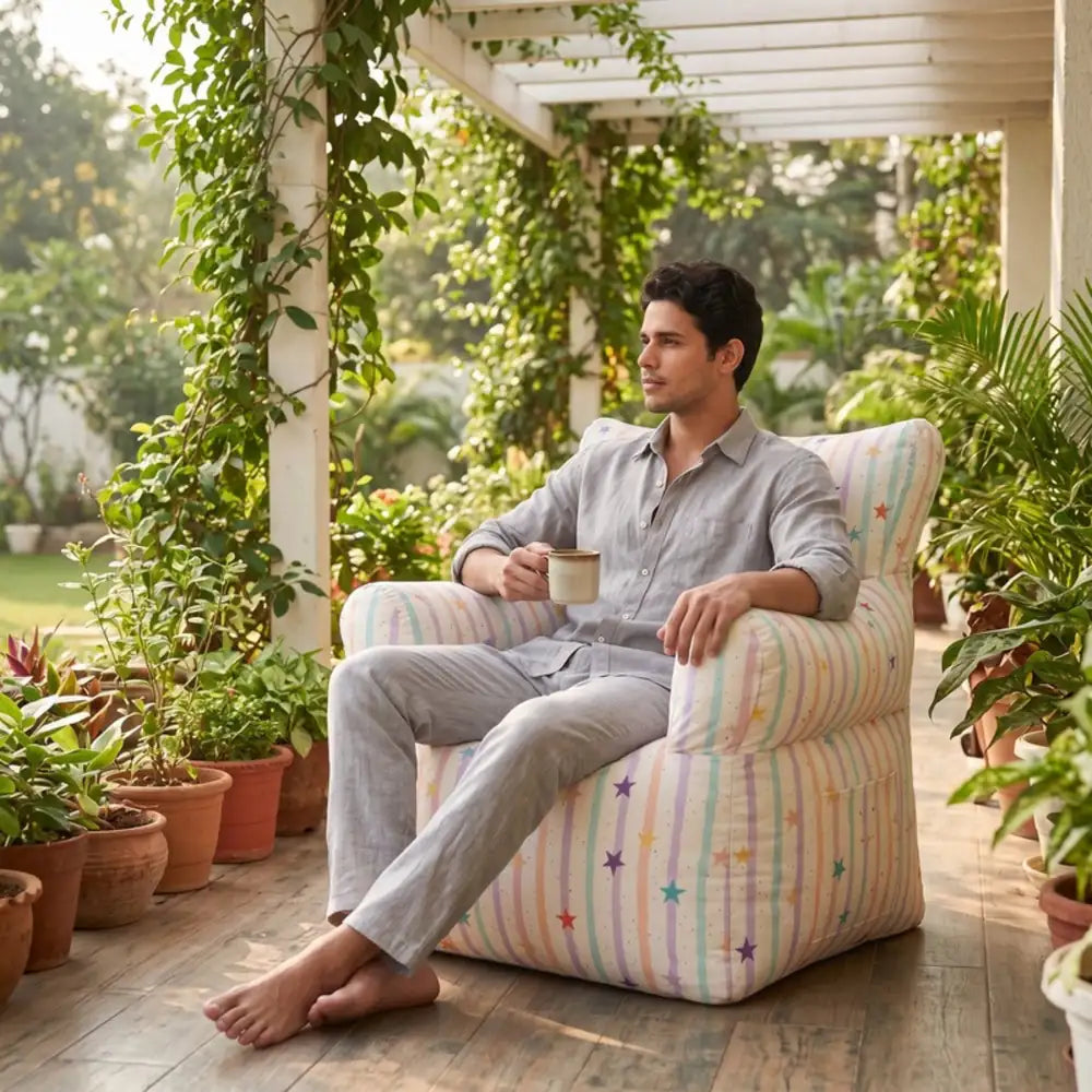 Royal Chair Joice under a garden pergola with a man relaxing - Magalis Egypt